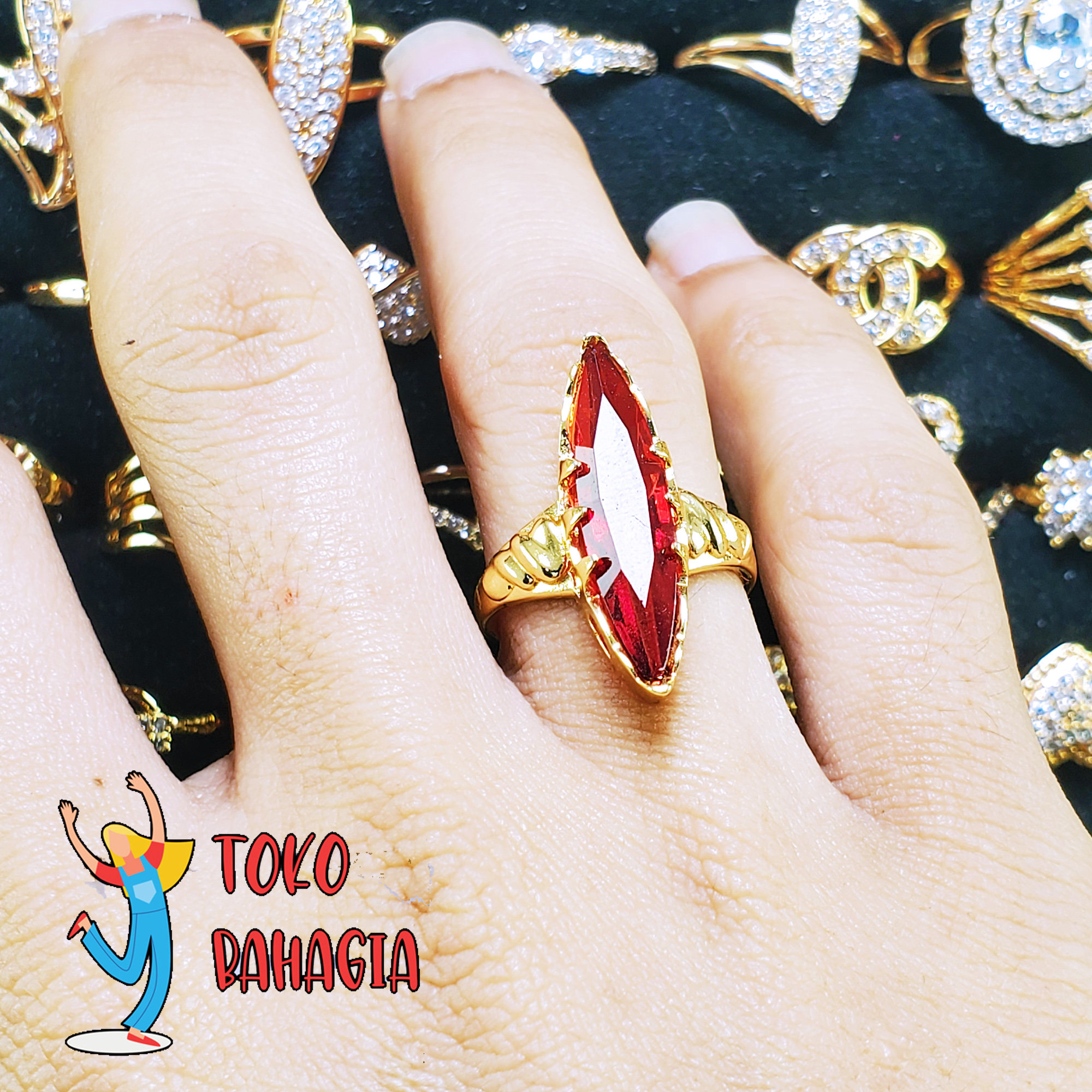 Bahagia Store Cincin Fhasion Wanita Cantik Motif Batu Merah Delima Lonjong Gold 24 K Bahagia Store Cincin Fhasion Wanita Cantik Motif Batu Merah Delima Lonjong Gold 24 K